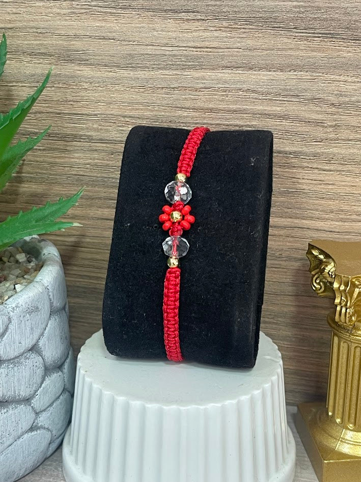PULSO EN ORO LAMINADO ROJO FLOR