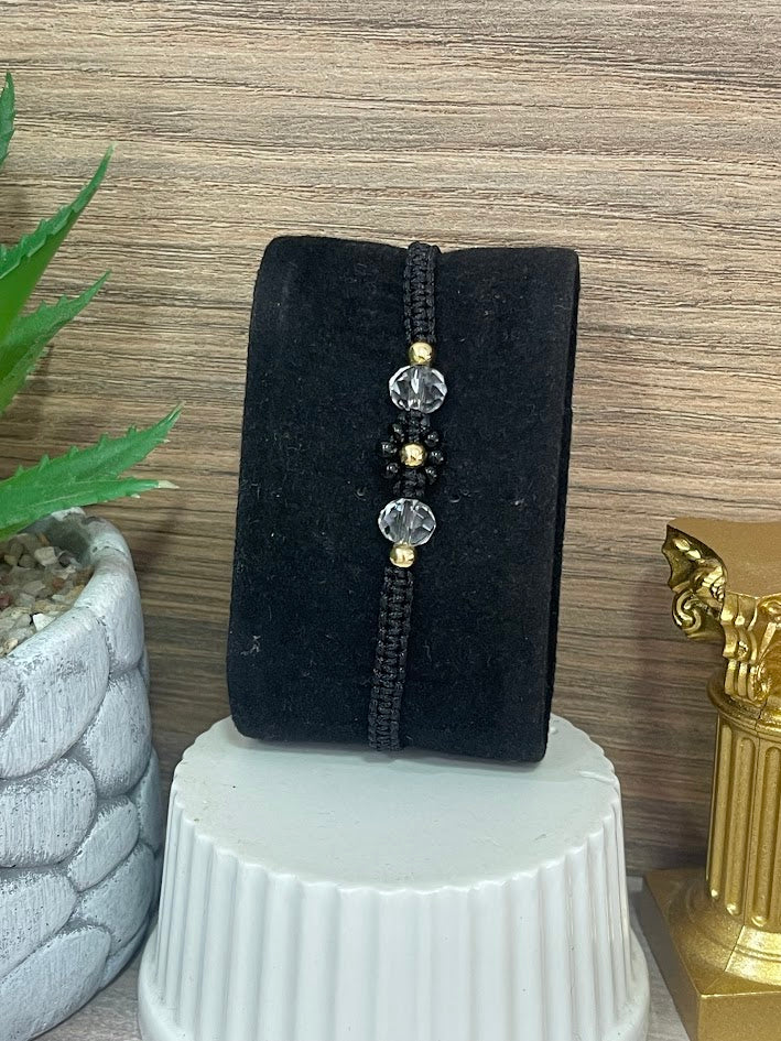 PULSO EN ORO LAMINADO FLOR NEGRO