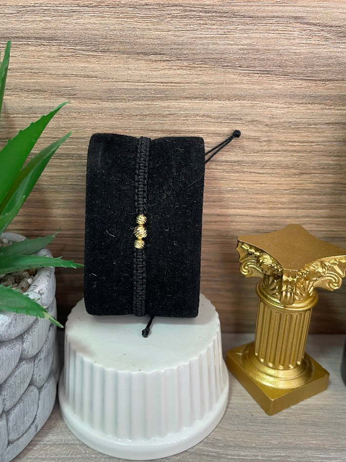 PULSERA TEJIDA NEGRA 3 BAILES ORO LAMINADO