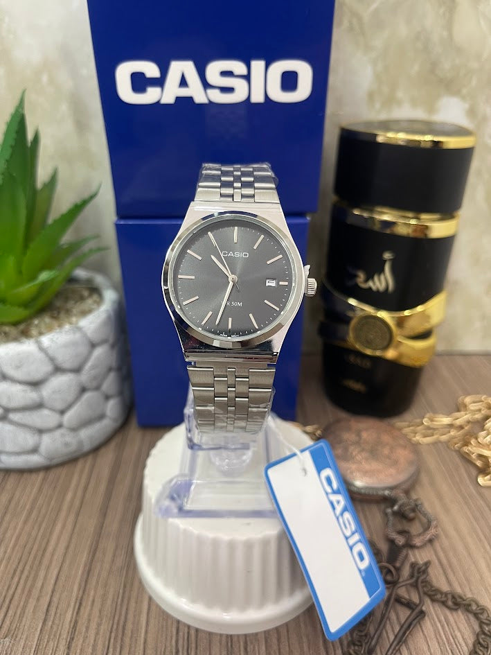 CASIO DAMA PLATEADO ESFERA NEGRA MANILLA TRENZADA