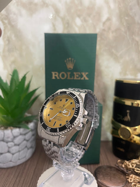 ROLEX PLATEADO ESFERA DORADA ARO NEGRO INCLUYE CAJA
