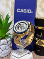 CASIO METALICO DORADO FONDO BLANCO ARO AZUL