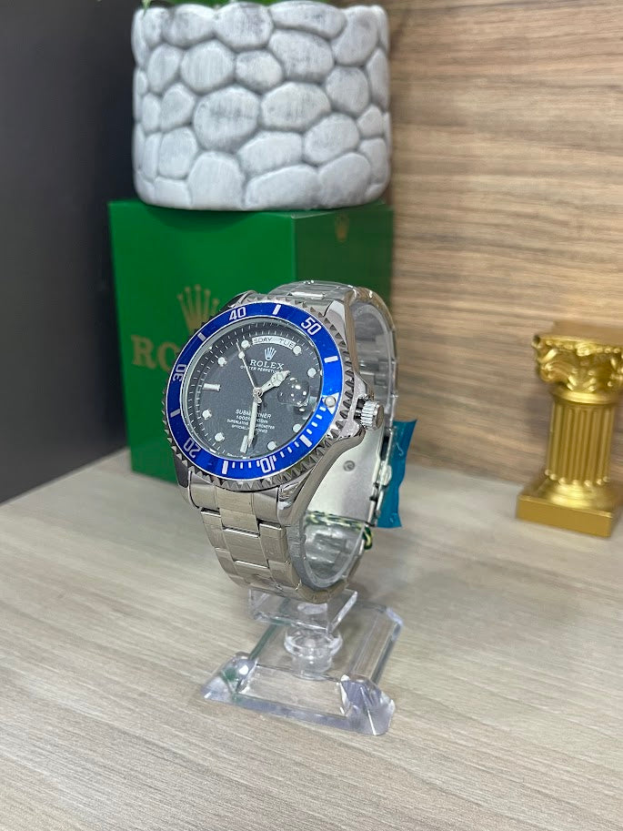 RELOJ ROLEX CABALLERO PLATEADO ESFERA NEGRA ARO AZUL