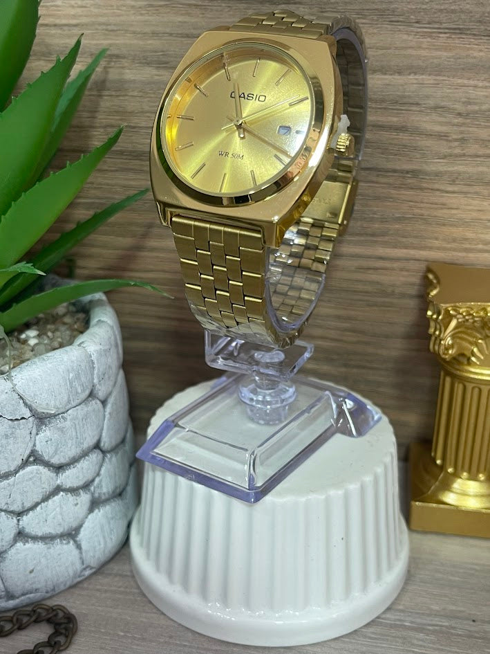casio dorado esfera dorada con calendario