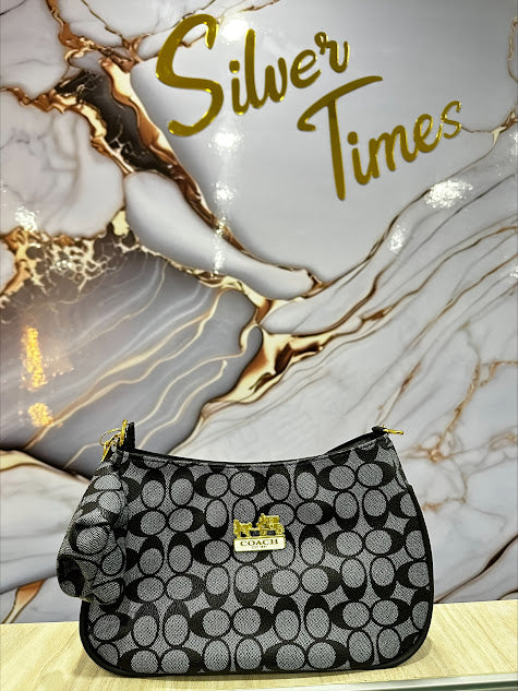 CARTERA DE MANO COACH