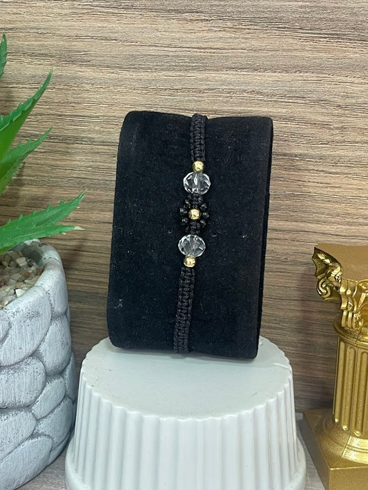 PULSO EN ORO LAMINADO FLOR NEGRO