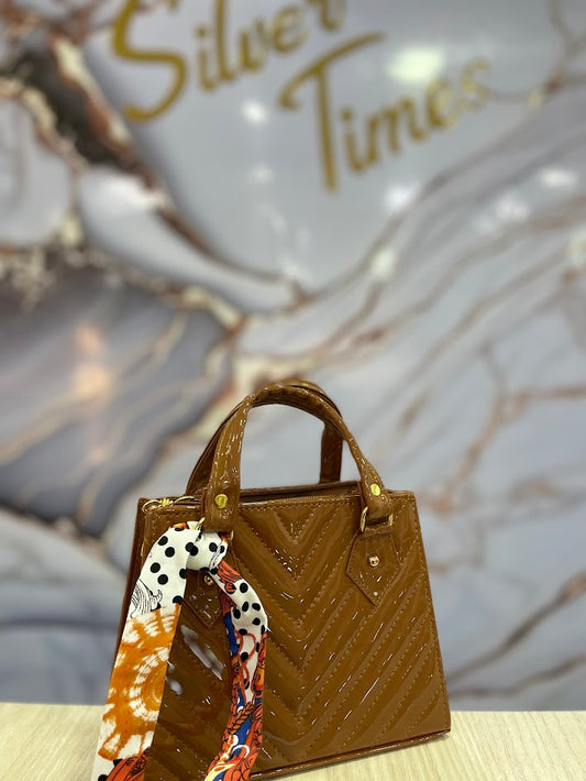 BOLSO TIPO CARTERA MARRON CHAROL