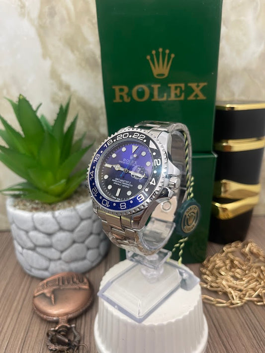 ROLEX CABALLERO PLATEADO ESFERA AZUL Y NEGRA ARO AZUL Y NEGRO