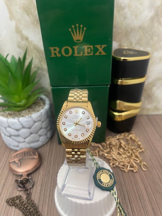 ROLEX DAMA DORADO MANILLA TRENZADA ESFERA PLATEADA