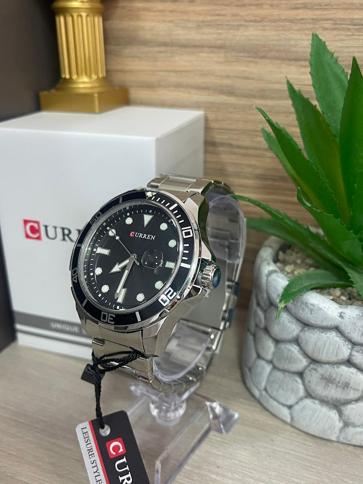 RELOJ CURREN PLATEADO ARO Y FONDO NEGRO CON CALENDARIO