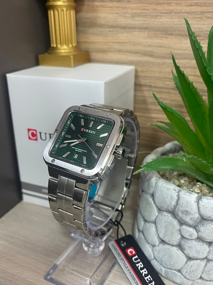 RELOJ CURREN CUADRADO PLATEADO FONDO VERDE CON CALENDARIO