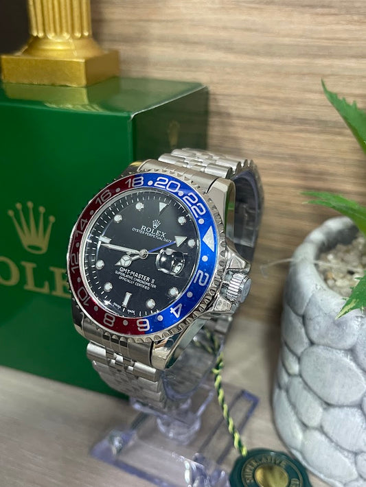 ROLEX CABALLERO PLATEADO ARO AZUL CON ROJO FONDO NEGRO CON CALENDARIO