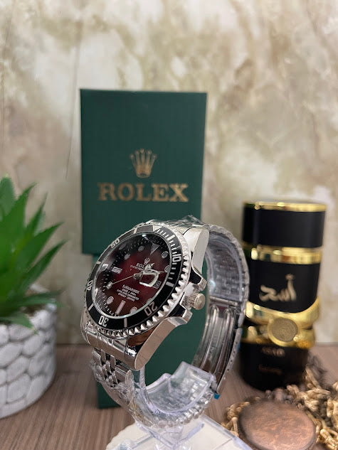 ROLEX PLATEADO ESFERA VINOTINTO ARO NEGRO INCLUYE CAJA