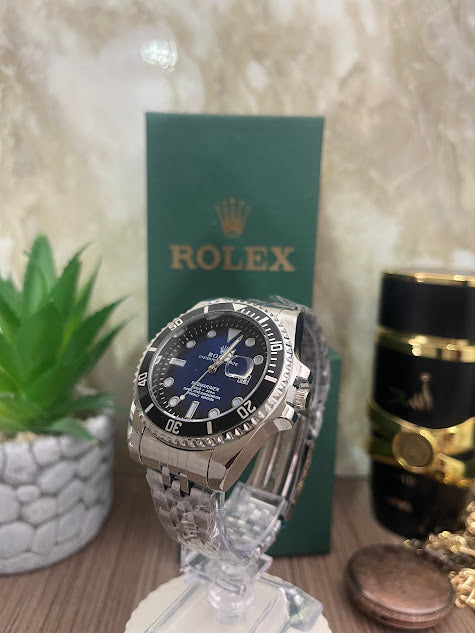 ROLEX PLATEADO ESFERA AZUL ARO NEGRO INCLUYE CAJA