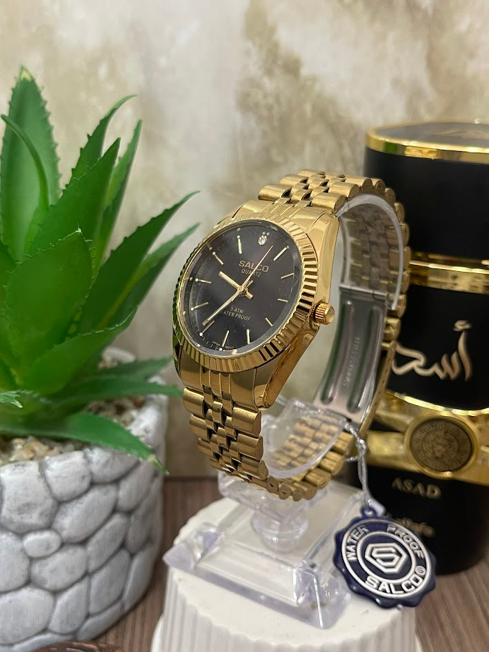 RELOJ SALCO DAMA DORADO ESFERA NEGRA ARO ESTRIAS
