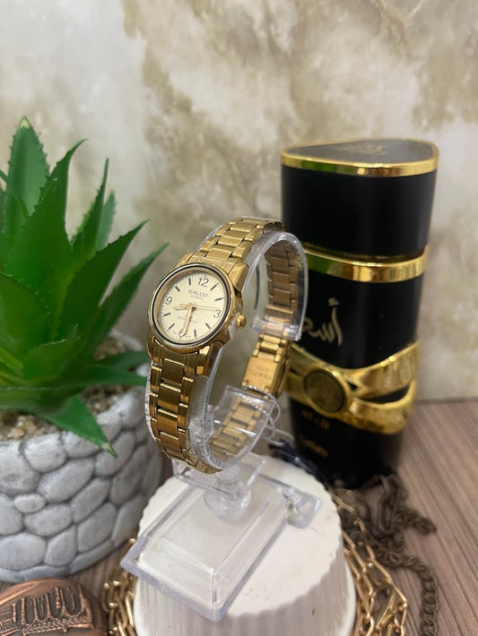 RELOJ SALCO DAMA DORADO NUMEROS NEGROS