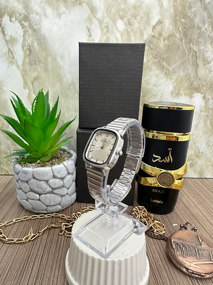 RELOJ BLU DAMA MANILLA PLATEADA CUADRADO ESFERA BLANCA