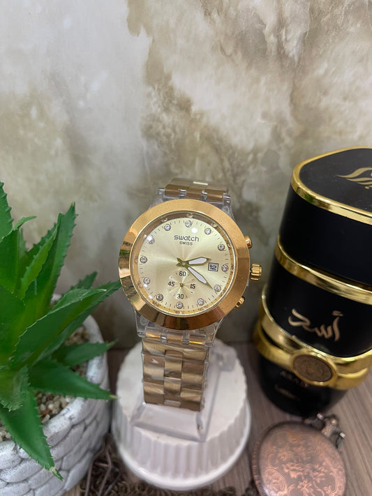 RELOJ SWATCH DORADO CAJA EN ACRILICO