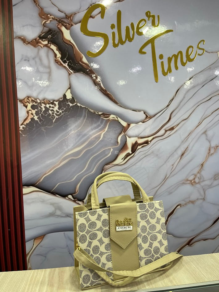 BOLOS DAMA COACH BEIGE ESTILO BAUL OVALOS