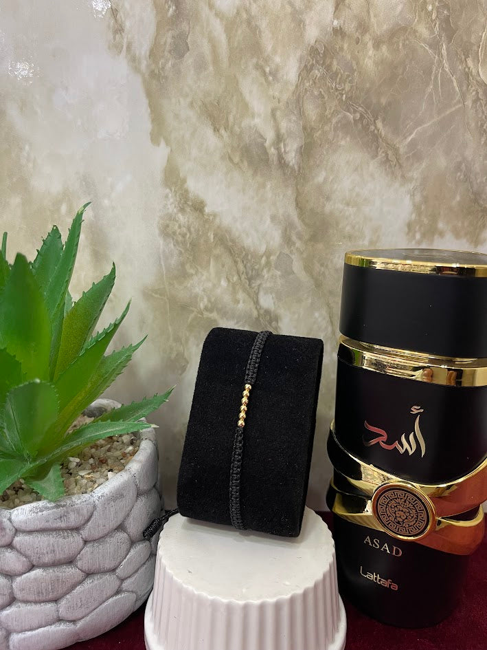 PULSERA NEGRA TEJIDA BALINES X 6