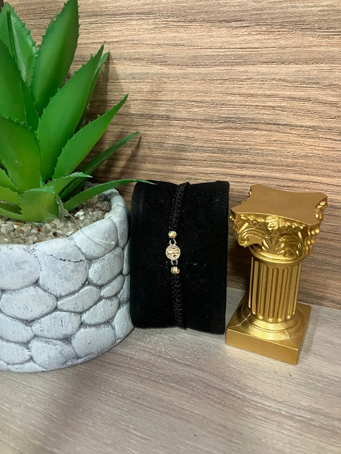 PULSO NEGRO EN ORO LAMINADO SAN BENITO