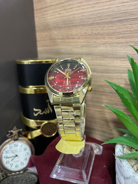 RELOJ ORIENT DORADO Y ROJO