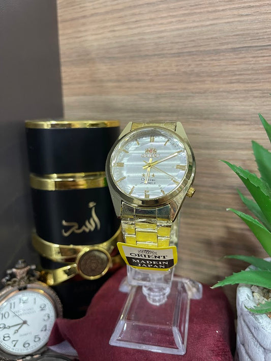RELOJ ORIENT DORADO Y PLATEADO