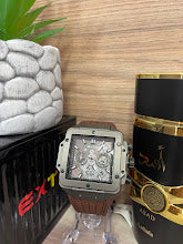 RELOJ EXTRI NEGRO GRIS Y MARRON