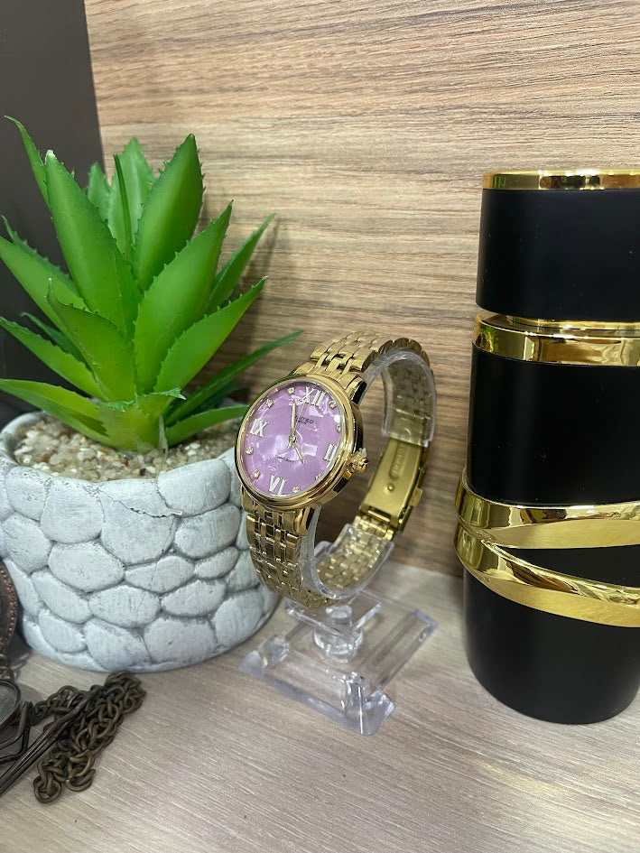 RELOJ LIMITED DORADO FONDO LILA