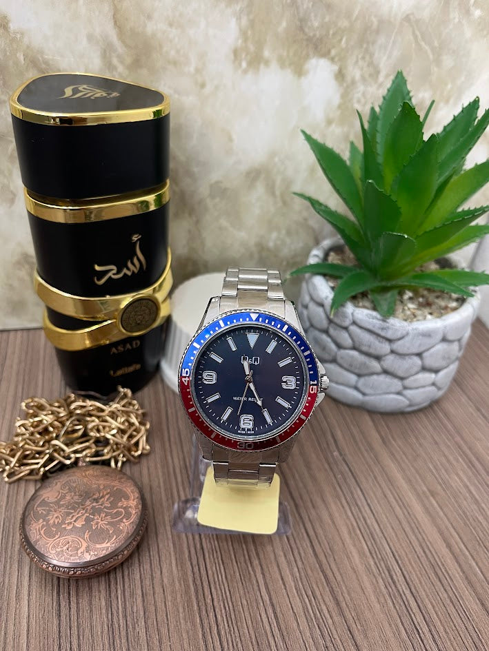 RELOJ Q&Q PLATEADO ESFERA AZUL ARO ESTILO PEPSI