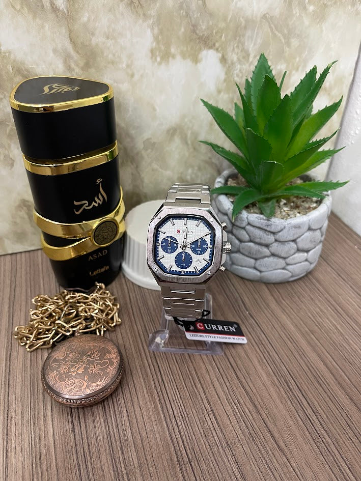 RELOJ CURREN CUADRADO PLATEADO FONDO AZUL CON BLANCO