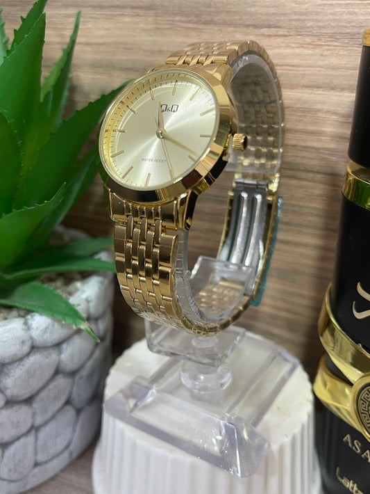 RELOJ QYQ DAMA DORADO MANILLA TRENZADA
