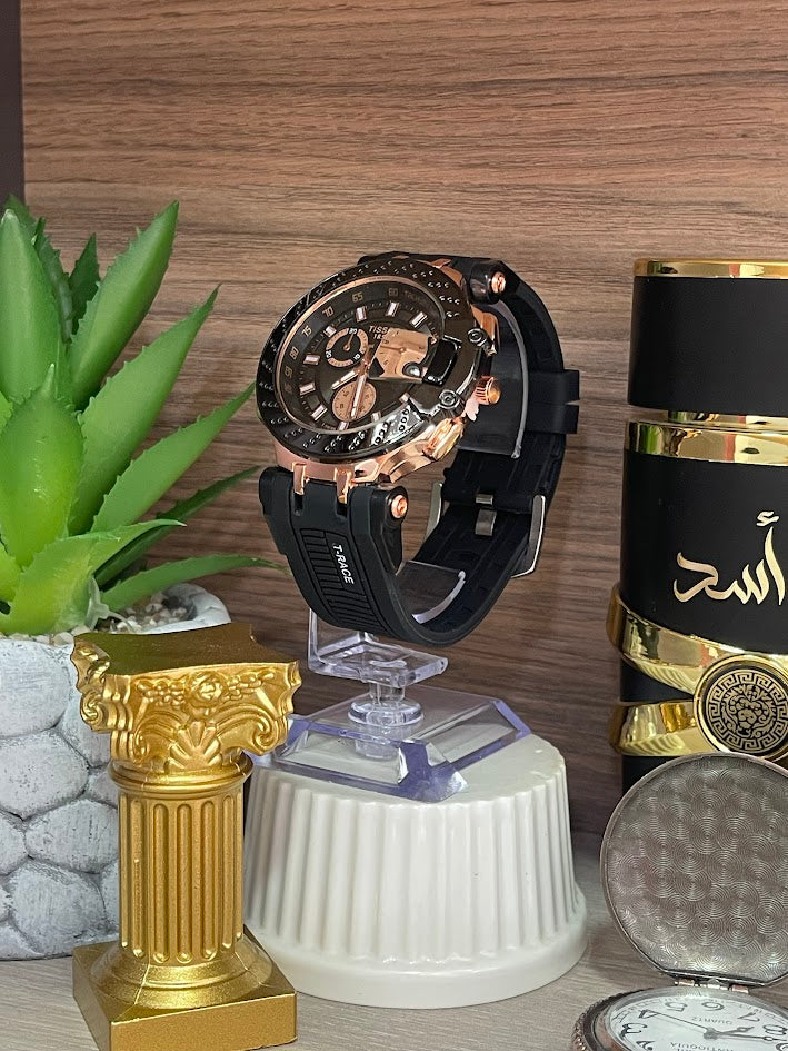 RELOJ TISSOT ORO ROSA ESFERA NEGRA ARO NEGRO MANILLA SILICONA NEGRA