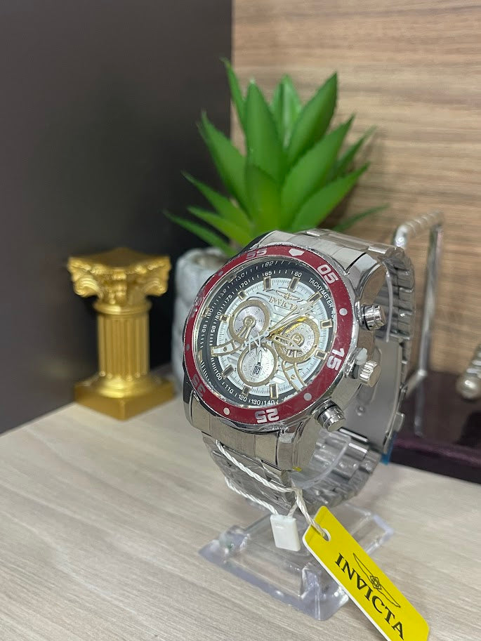 RELOJ INVICTA PLATEADO ARO ROJO