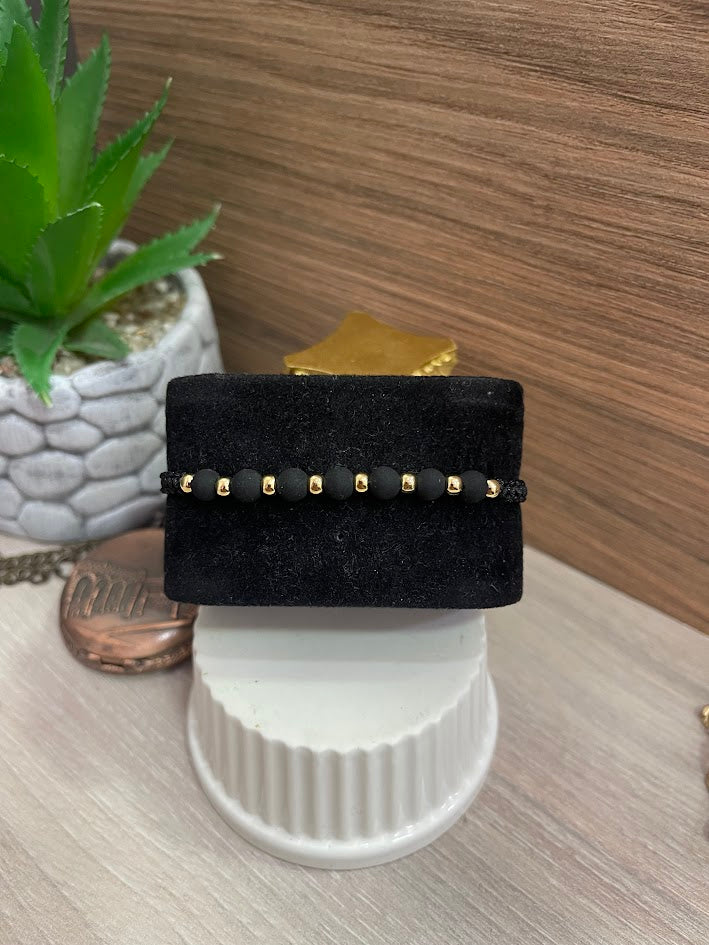 PULSERA TEJIDA NEGRA NEOPRENO BALIN 4MM ORO LAMINADO