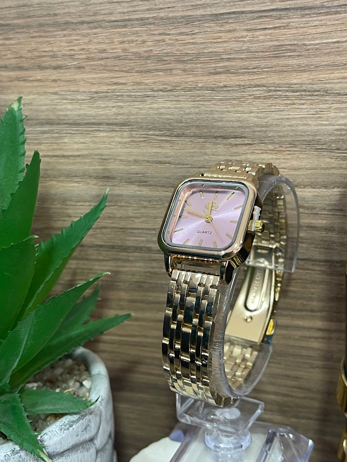 RELOJ BLUE DAMA DORADO FONDO ROSADO