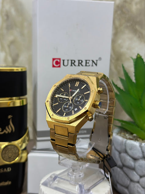 CURREN TODO DORADO FONDO NEGRO OVALADO